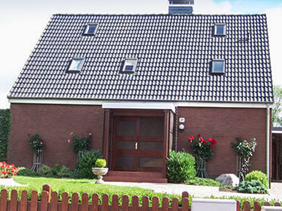 Foto: Einfamilienhaus mit behandeltem Dach nach zehn jahren